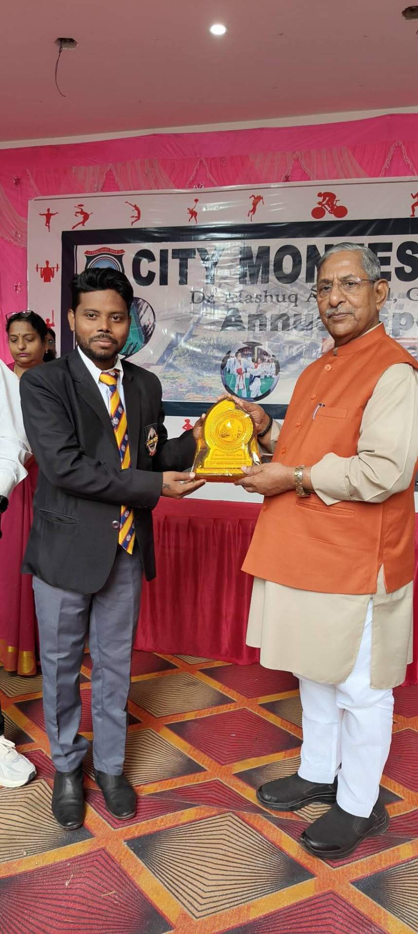 Rensei Akhilesh Kumar receiving felicitation memento at City Montessori School annual function
